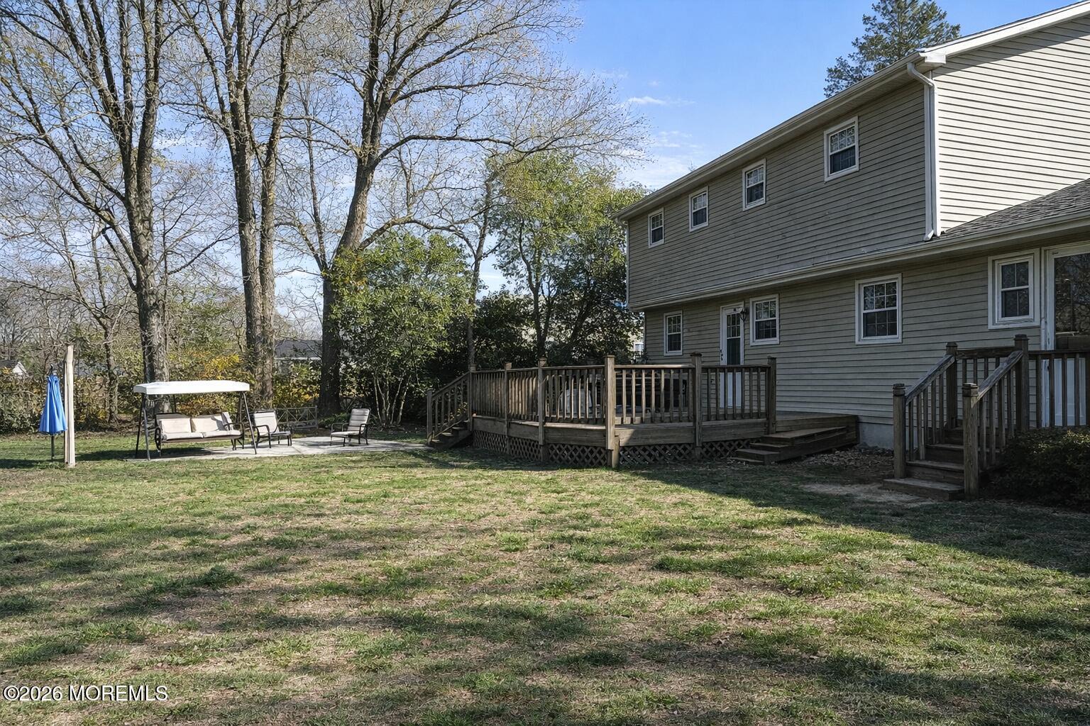 4 Westbrook Road Howell, NJ 07731 - Photo 13 of 18 a view of a backyard with a small cabin