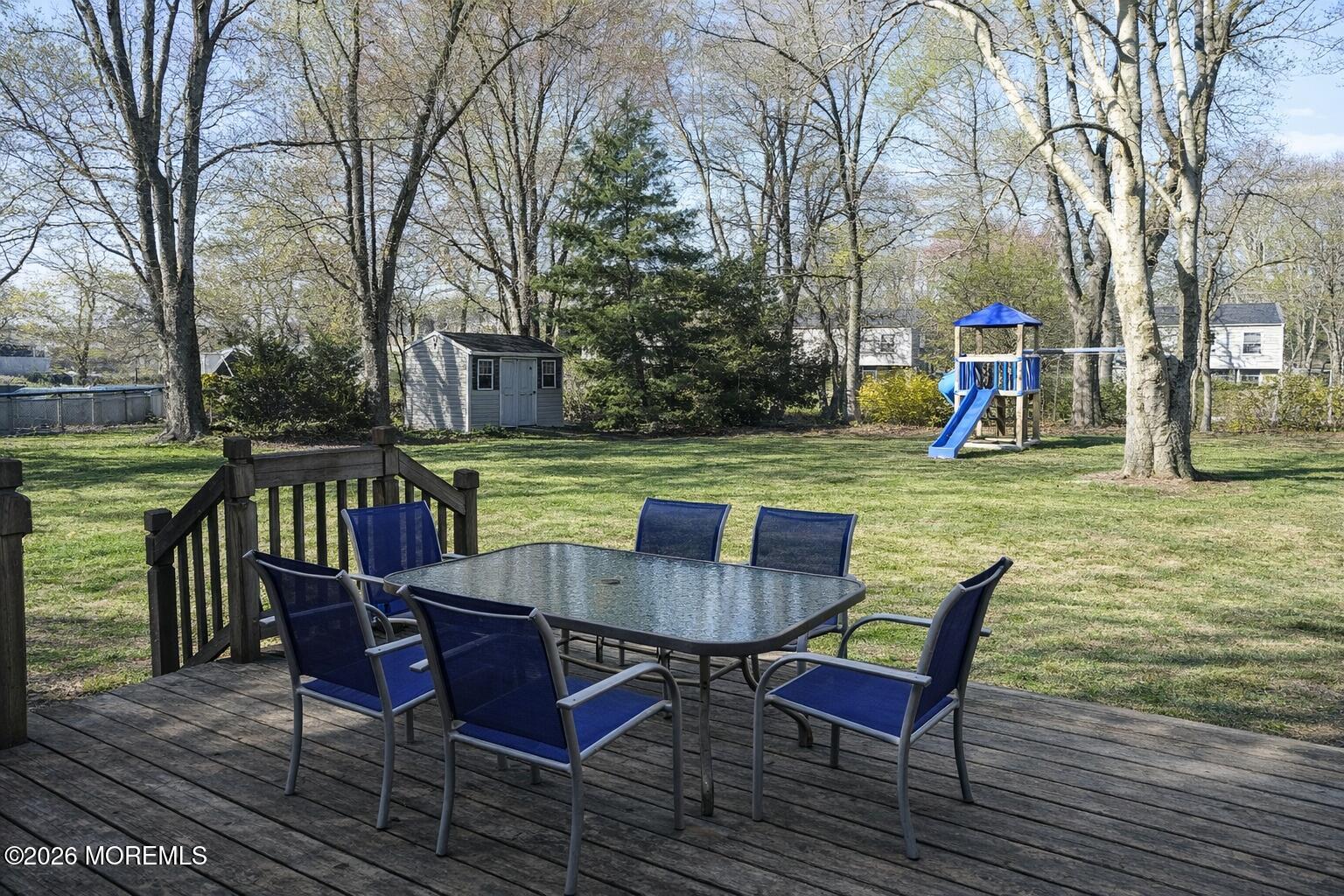 4 Westbrook Road Howell, NJ 07731 - Photo 14 of 18 a view of a chairs and table on the deck
