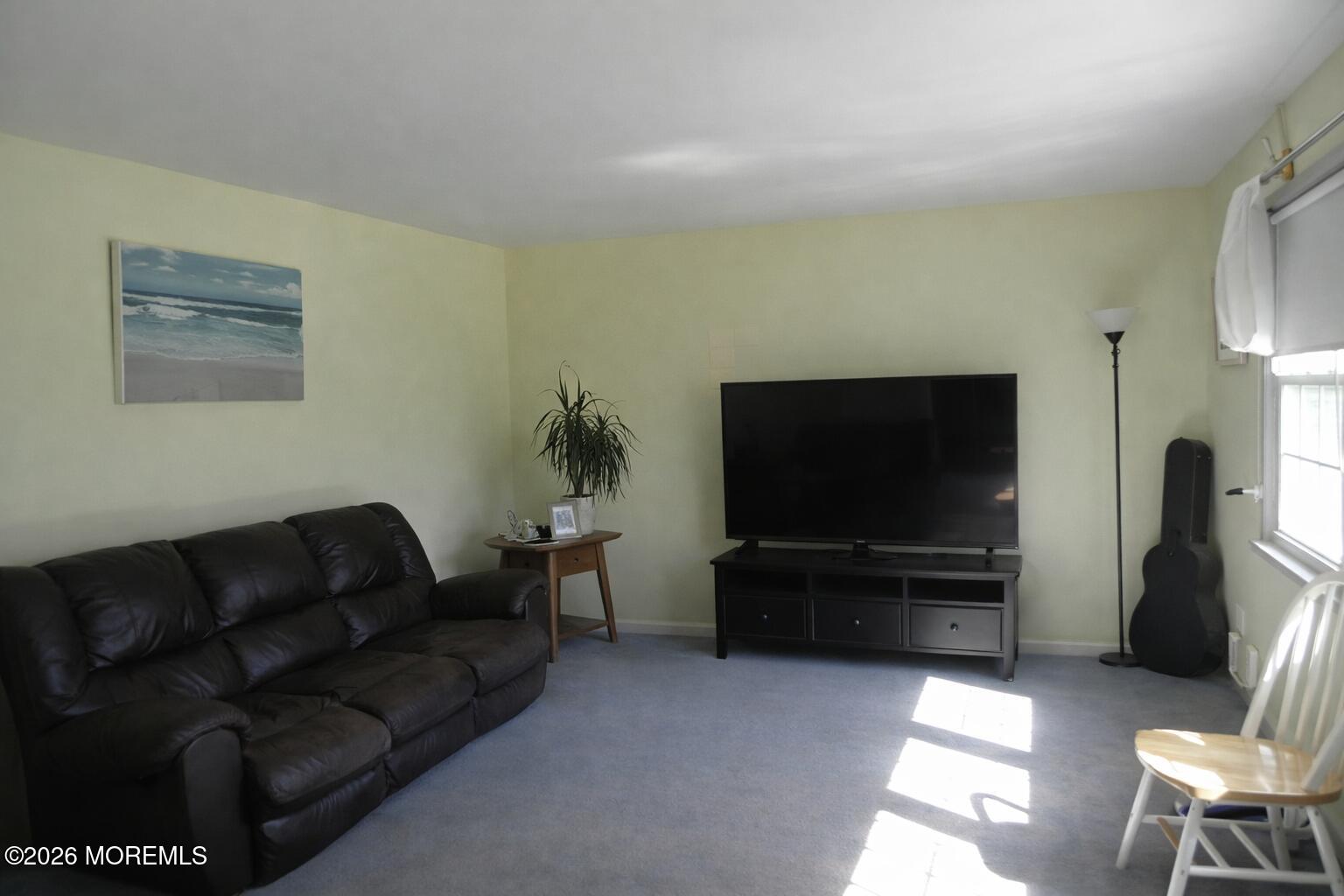 4 Westbrook Road Howell, NJ 07731 - Photo 3 of 18 a living room with furniture and a flat screen tv
