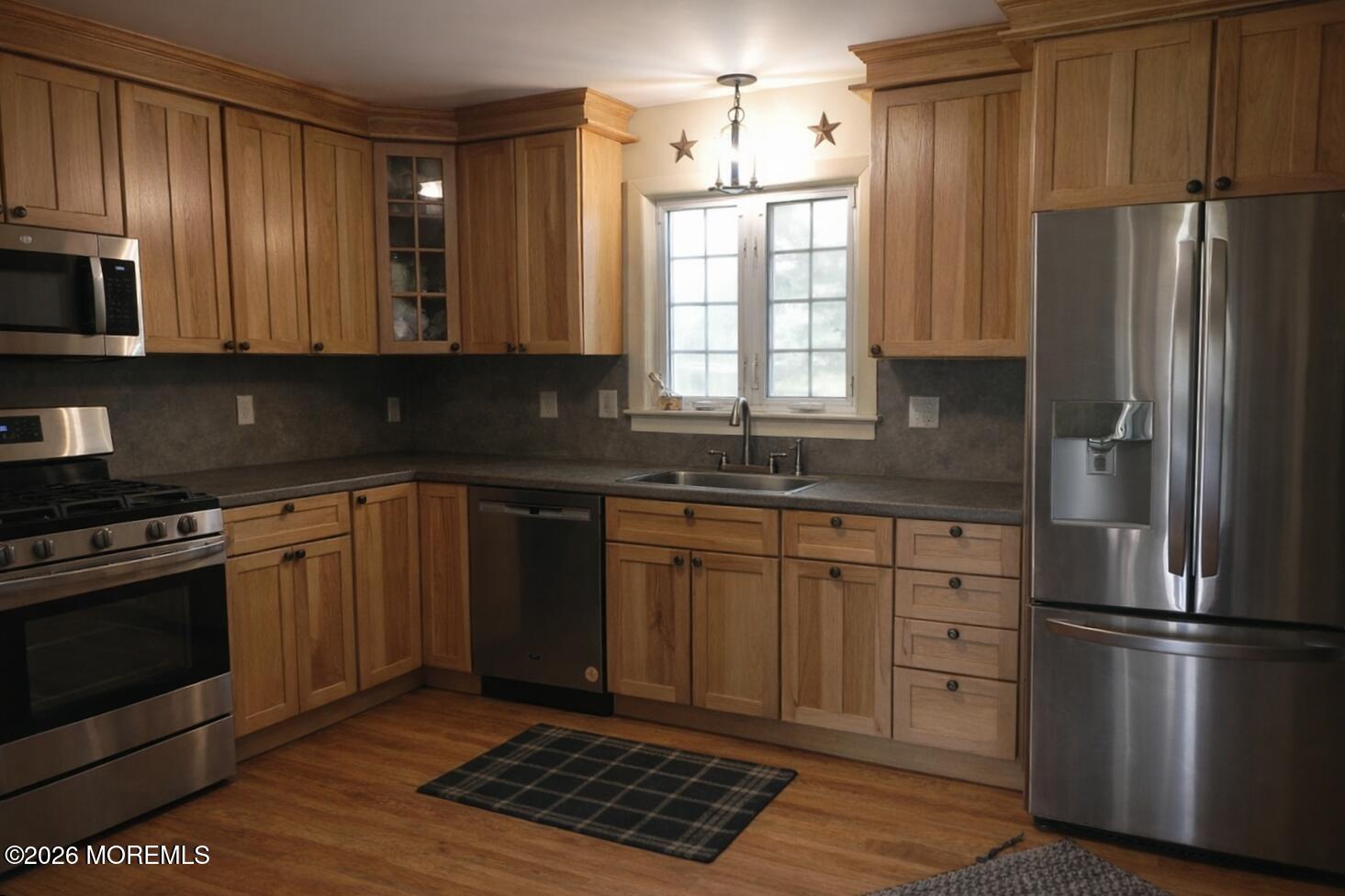 4 Westbrook Road Howell, NJ 07731 - Photo 5 of 18 a kitchen with stainless steel appliances granite countertop a refrigerator stove and sink