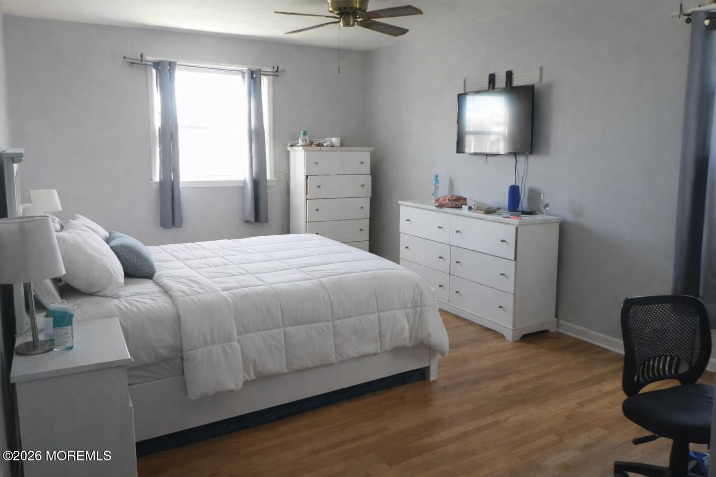 4 Westbrook Road Howell, NJ 07731 - Photo 8 of 18 a bedroom with a bed and a flat screen tv