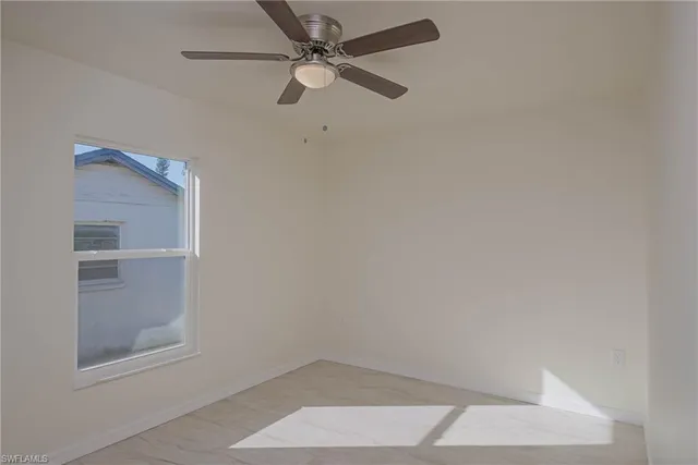 a bathroom with a shower curtain and a sink