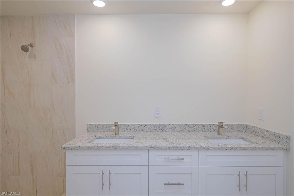 2120 French Street Fort Myers, FL 33916 - Photo 14 of 20 a bathroom with a granite countertop sink and white cabinets