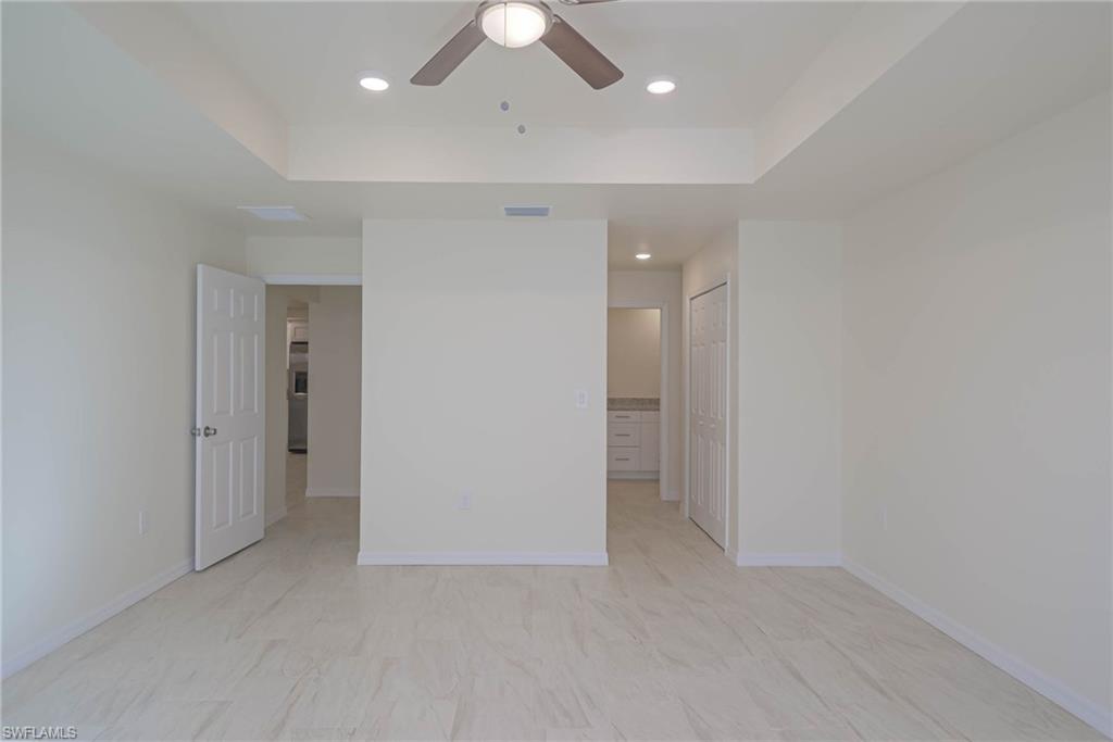 2120 French Street Fort Myers, FL 33916 - Photo 16 of 20 an empty room with closet and a hallway
