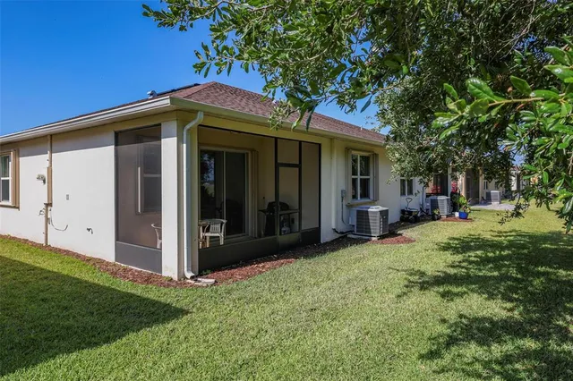 an aerial view of a house with a lake view
