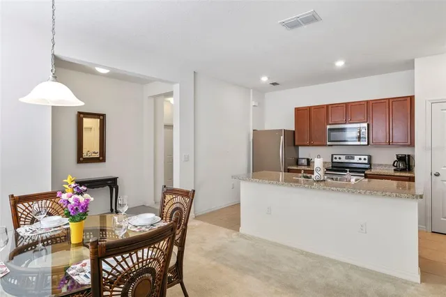 a kitchen with granite countertop counter space cabinets and stainless steel appliances