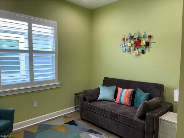 a living room with a couch and a window