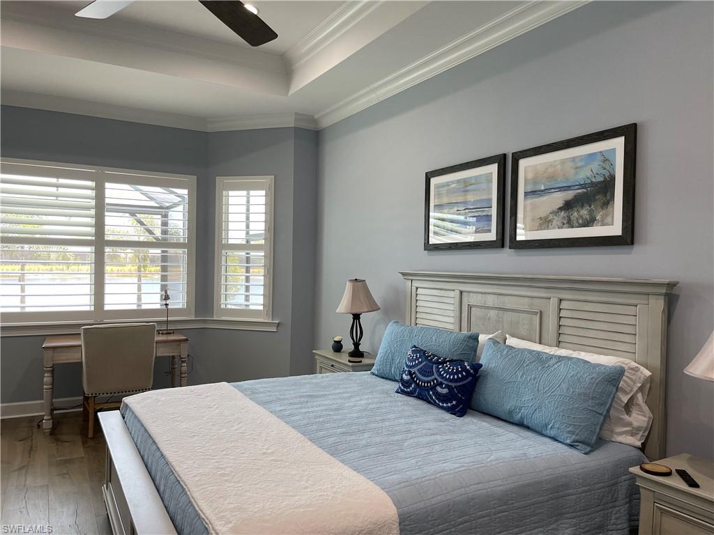 6282 Indies Avenue Naples, FL 34113 - Photo 13 of 33 a bedroom with a bed and a window