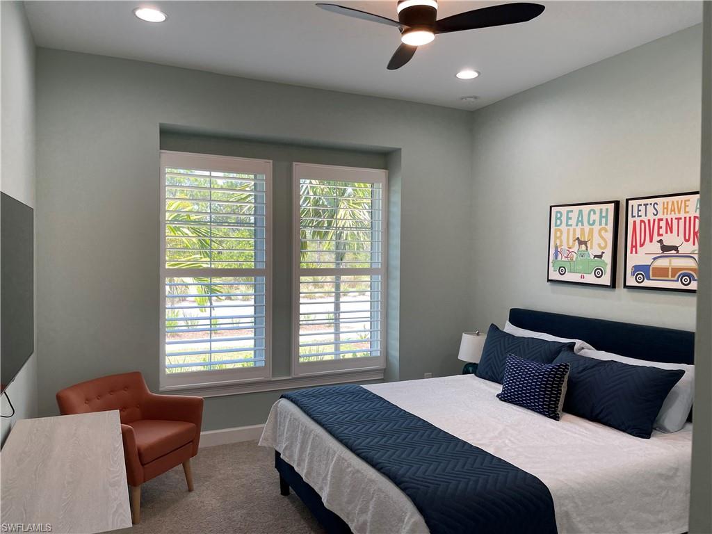 6282 Indies Avenue Naples, FL 34113 - Photo 15 of 33 a bedroom with a bed and wooden floor