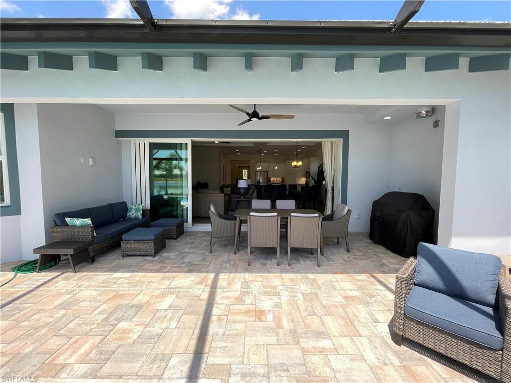 6282 Indies Avenue Naples, FL 34113 - Photo 20 of 33 a living room with furniture and a fireplace