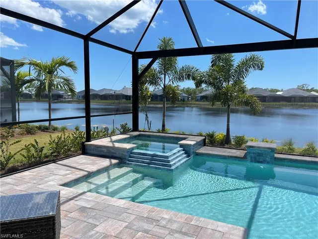 a view of a backyard with sitting area