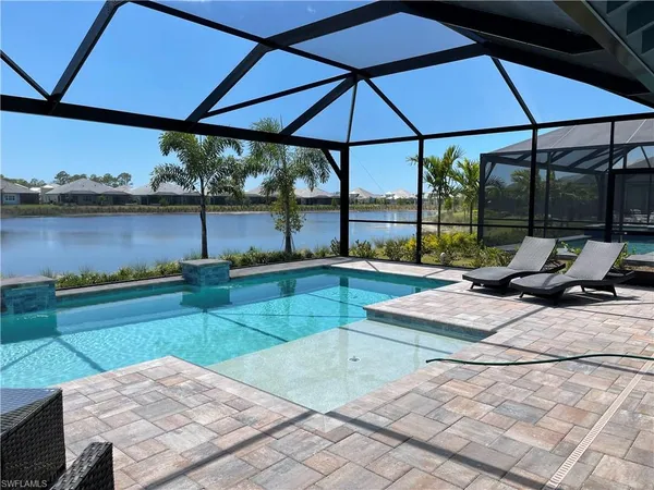 a view of a swimming pool with a patio