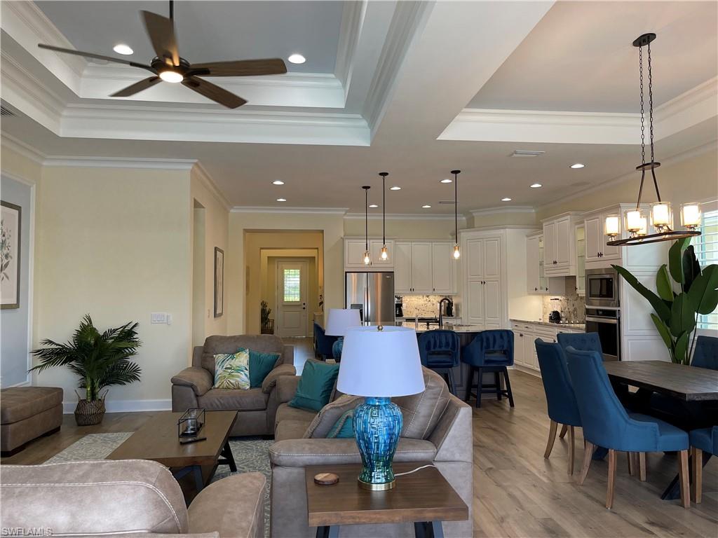 6282 Indies Avenue Naples, FL 34113 - Photo 7 of 33 a view of a dining room with furniture