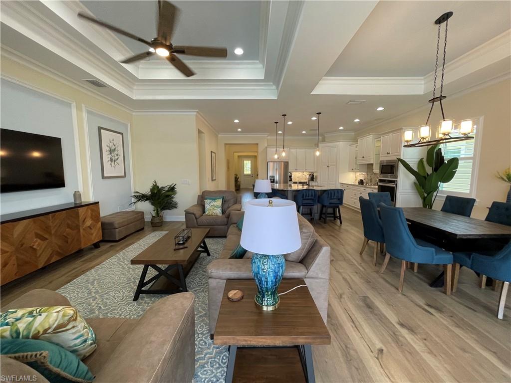 6282 Indies Avenue Naples, FL 34113 - Photo 8 of 33 a living room with furniture and a flat screen tv