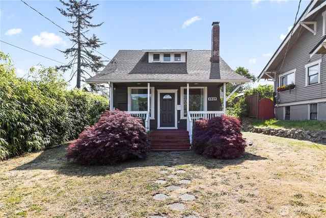 a front view of a house with a garden