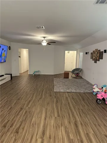 a view of a hallway with a hardwood floor