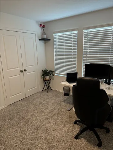 a work room with furniture and windows