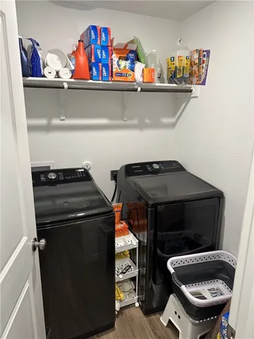 a view of hallway with wooden floor