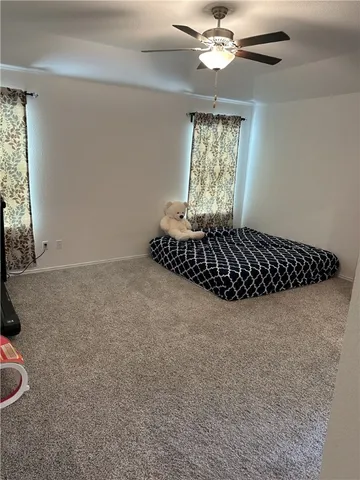 a view of living room with furniture and a window