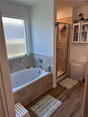 a bedroom with a bed and cabinets