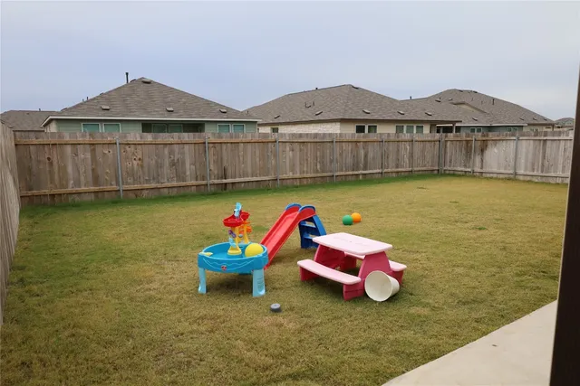 a backyard of a house with seating space