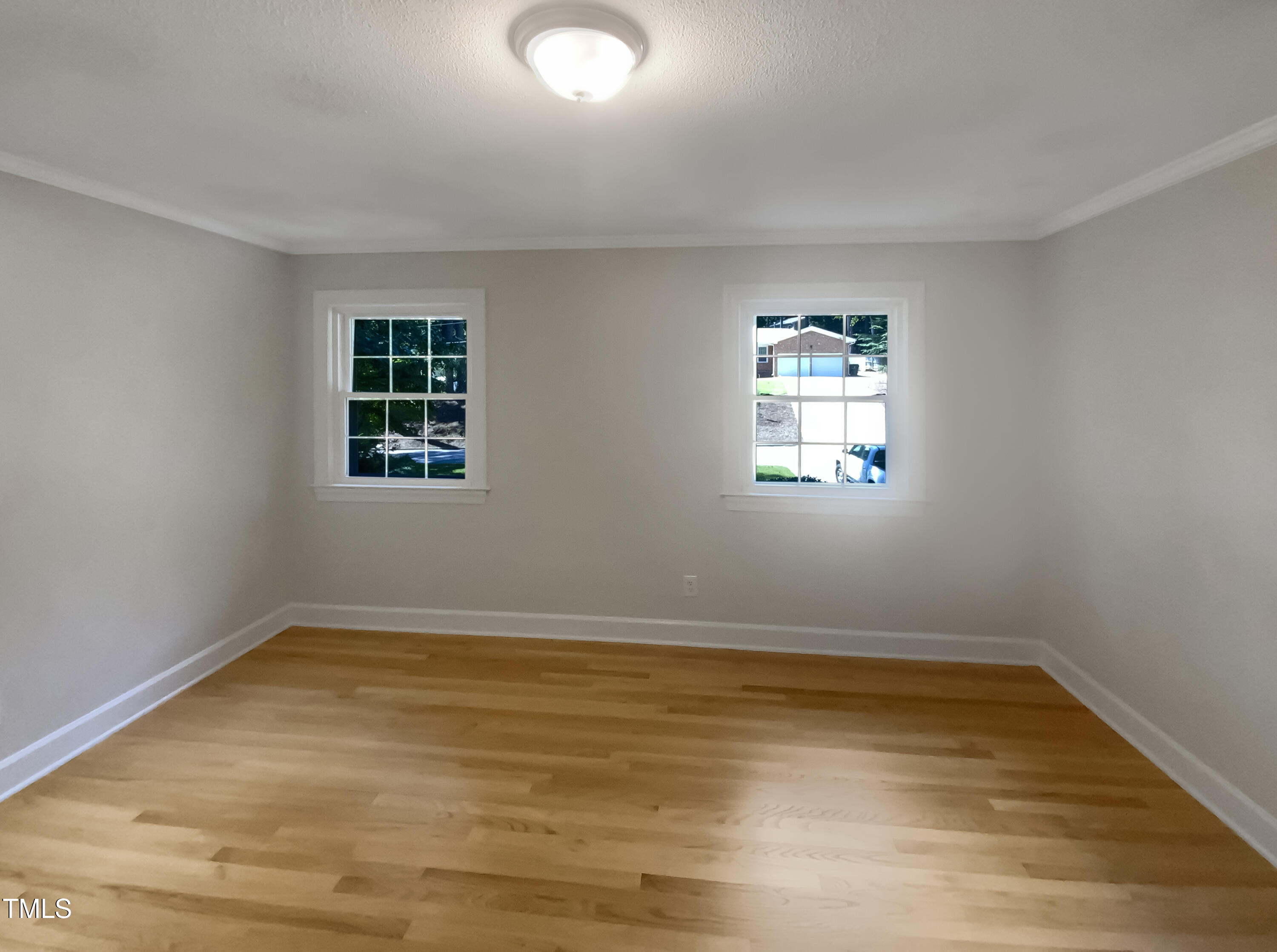 4808 Connell Drive Raleigh, NC 27612 - Photo 14 of 20 wooden floor in an empty room with a window