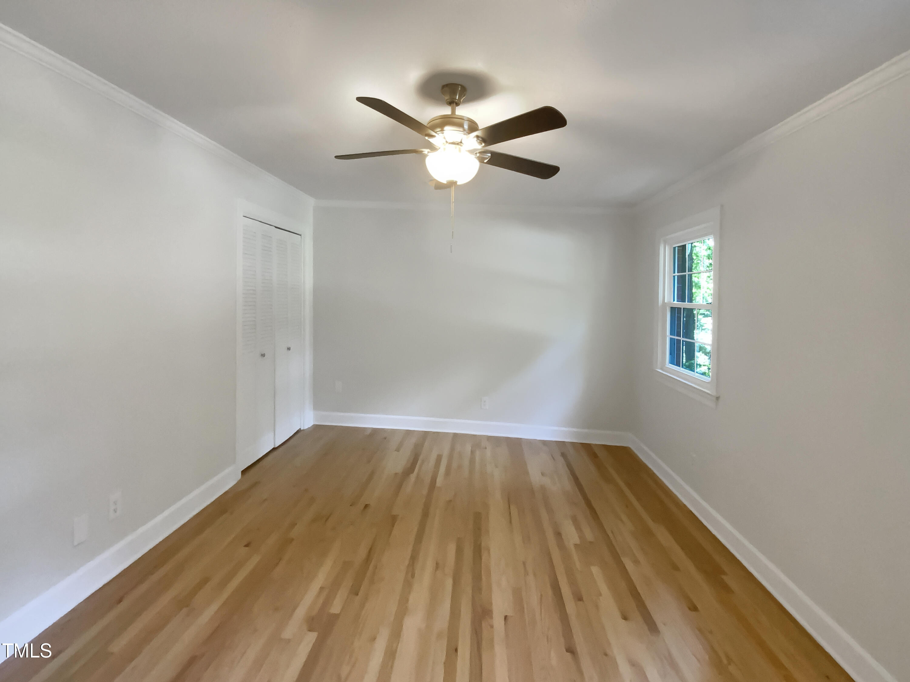 4808 Connell Drive Raleigh, NC 27612 - Photo 15 of 20 wooden floor in an empty room with a window