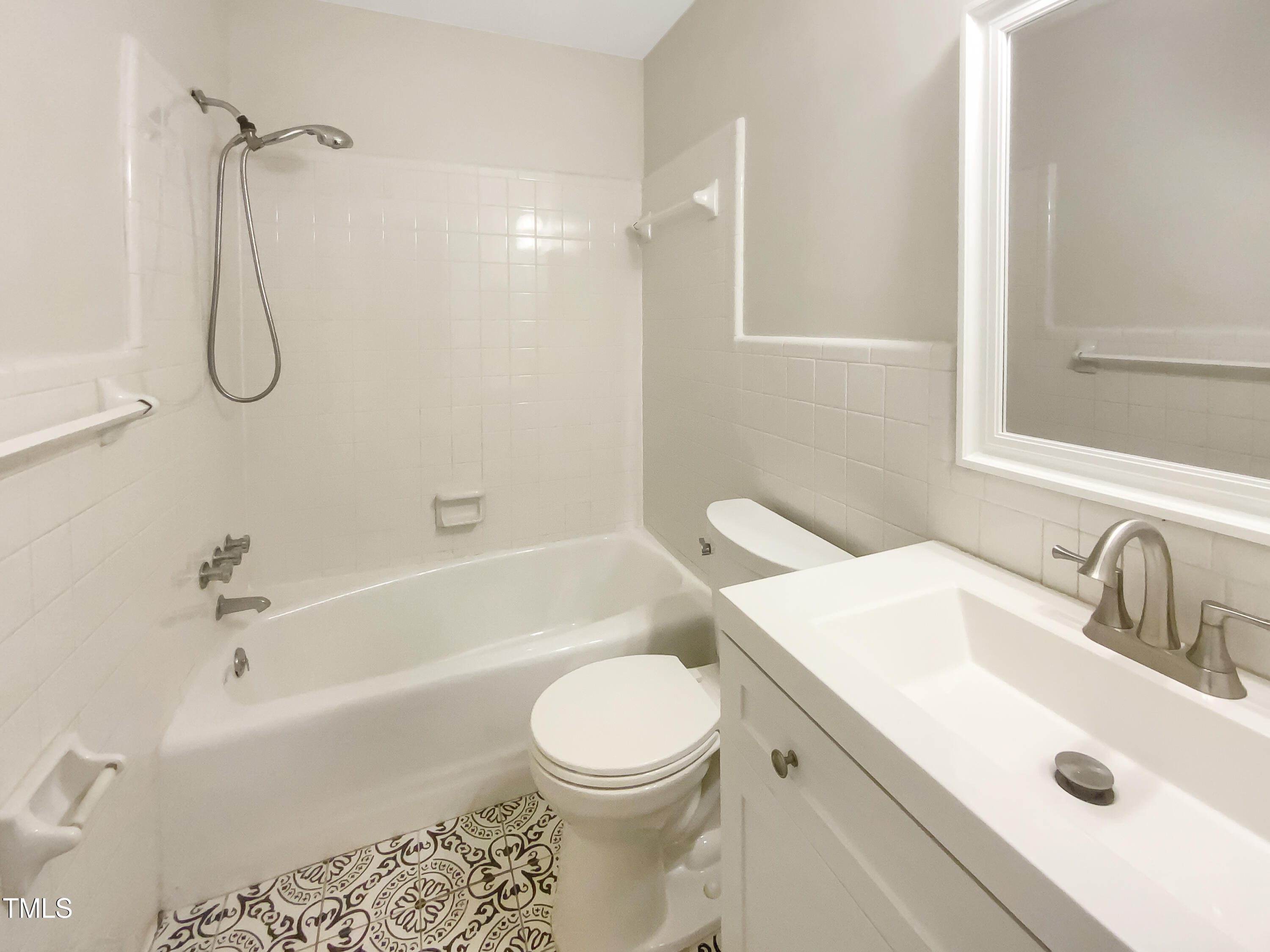 4808 Connell Drive Raleigh, NC 27612 - Photo 16 of 20 a bathroom with a sink a toilet and a bathtub
