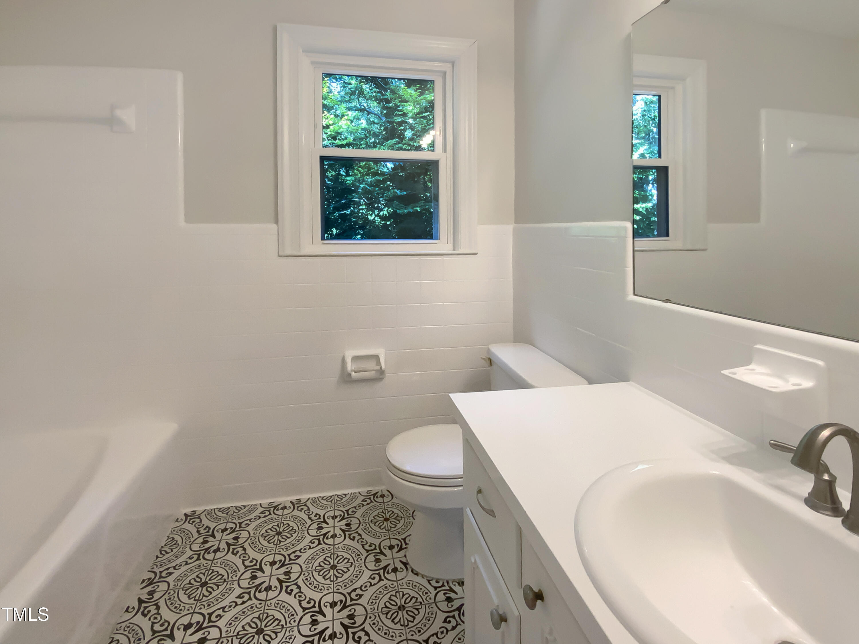 4808 Connell Drive Raleigh, NC 27612 - Photo 17 of 20 a bathroom with a sink and a toilet