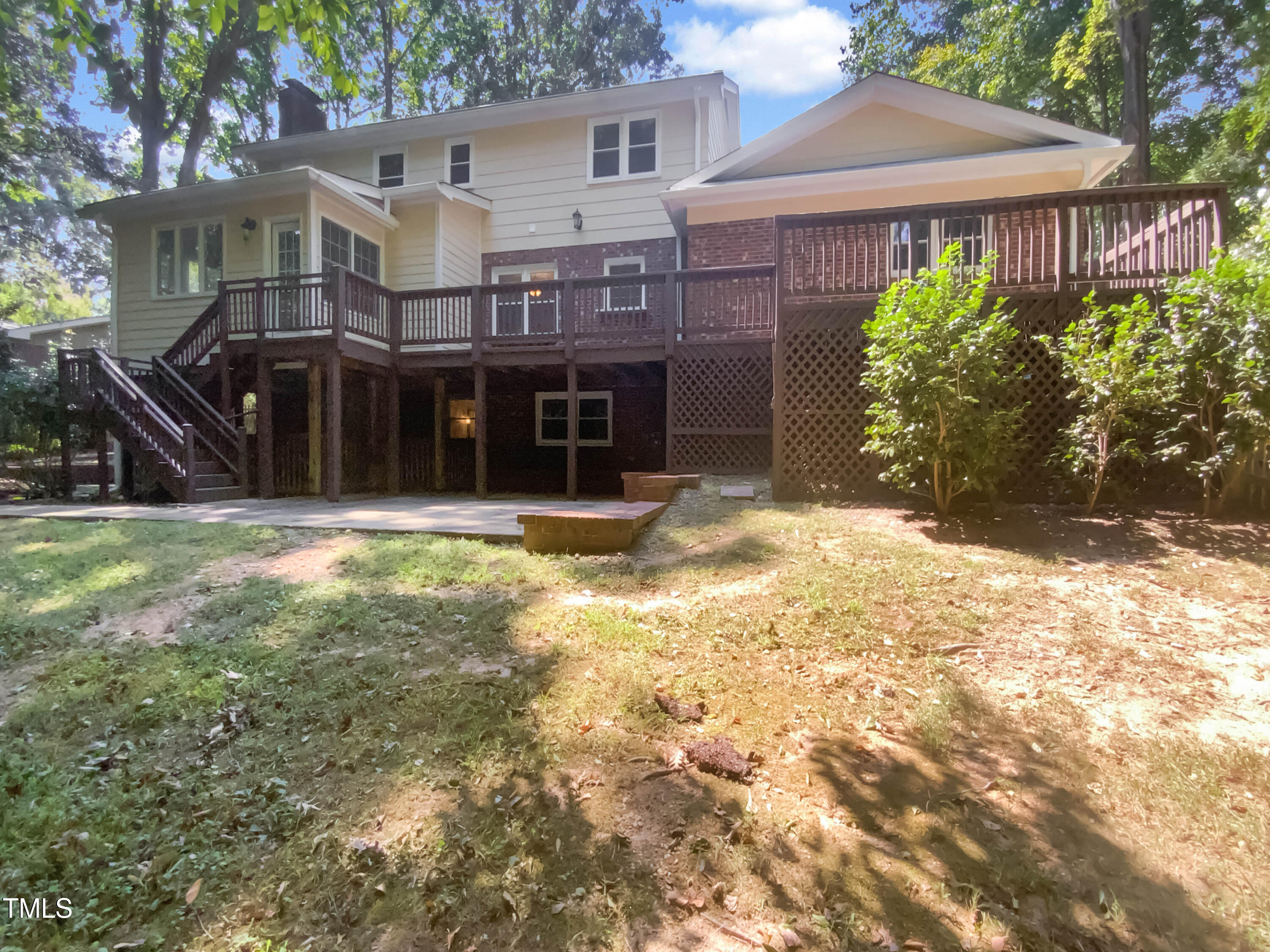 4808 Connell Drive Raleigh, NC 27612 - Photo 18 of 20 a view of a house with a yard and potted plants
