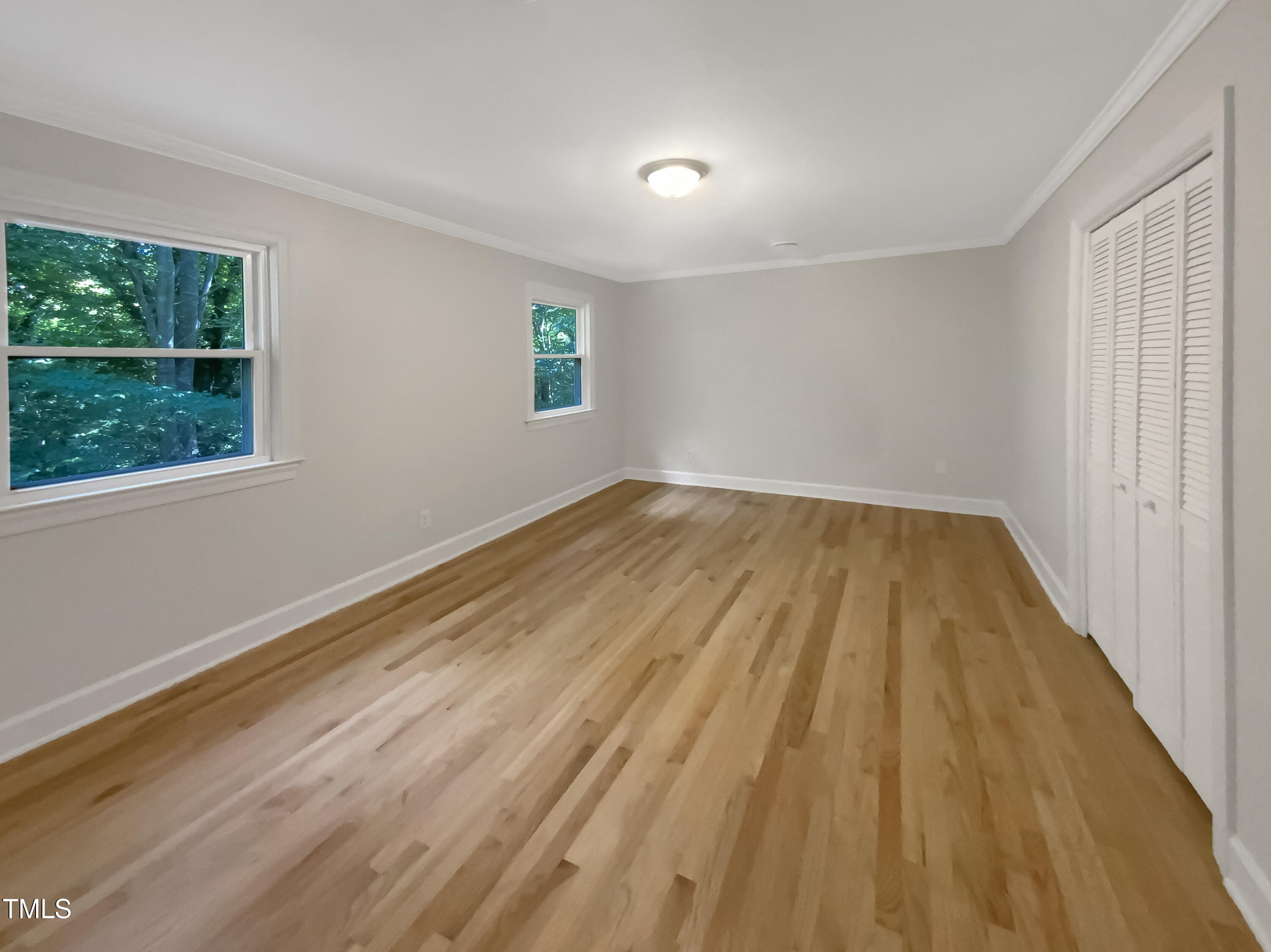 4808 Connell Drive Raleigh, NC 27612 - Photo 5 of 20 a view of wooden floor and windows in a room