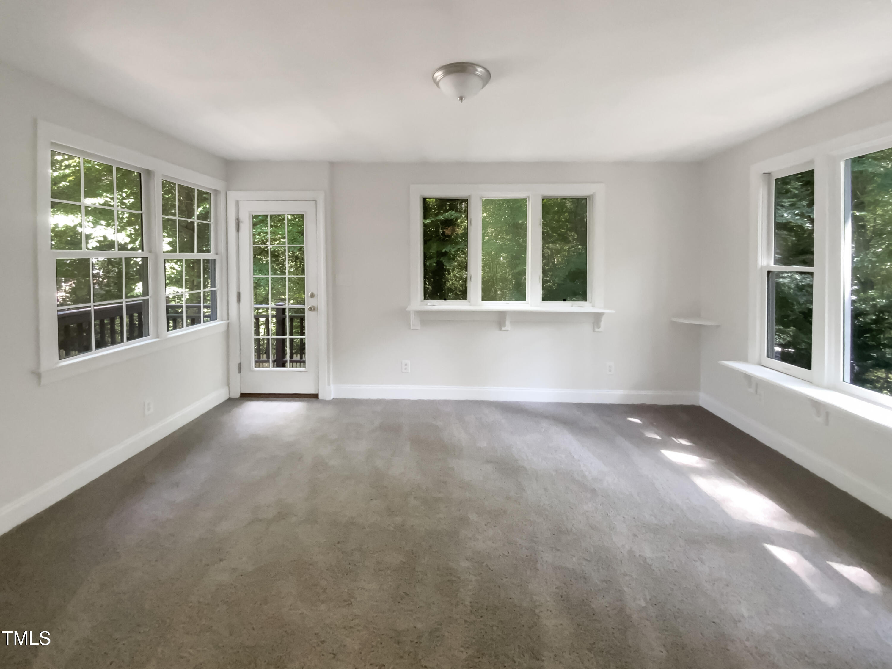 4808 Connell Drive Raleigh, NC 27612 - Photo 9 of 20 a view of an empty room with a window