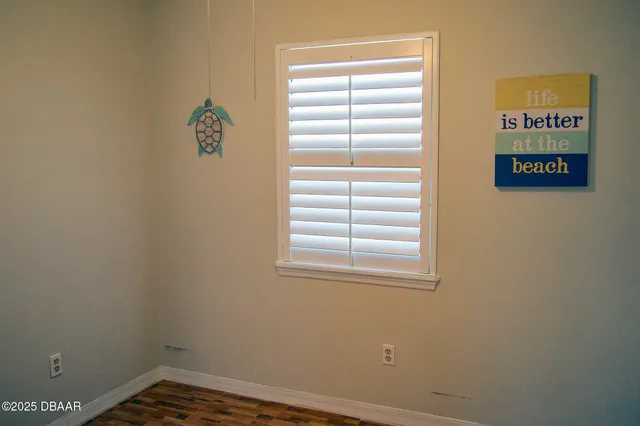 a view of an empty room with a window