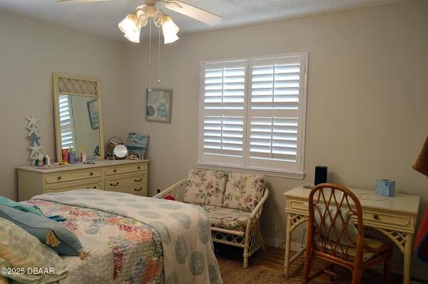 a bedroom with a bed and a table