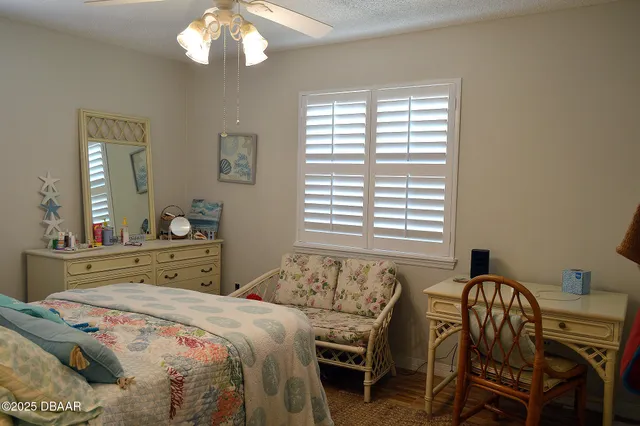 a bedroom with a bed and a table