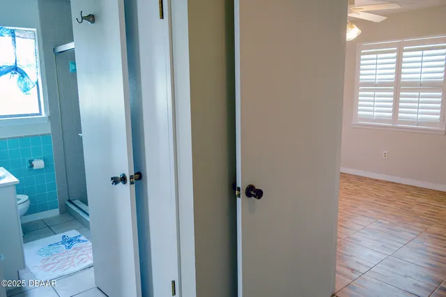 a bathroom with a granite countertop toilet a sink and shower