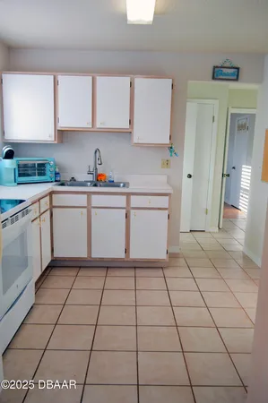 a kitchen with stainless steel appliances a sink and cabinets