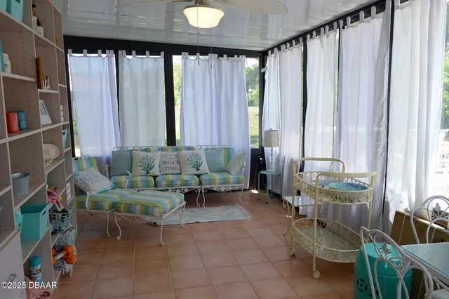 a view of a chairs and table in a livingroom