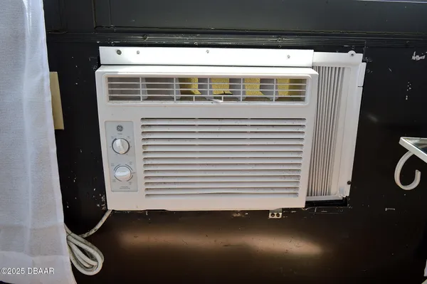 a living room with lots of furniture and a book shelf