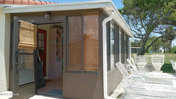 a front view of house with yard and seating area