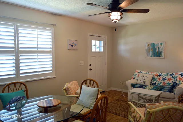 a dining room with furniture and window
