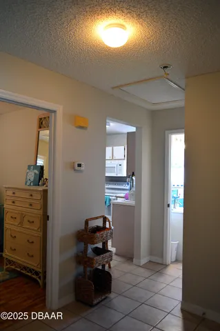 a view of a hallway with front door