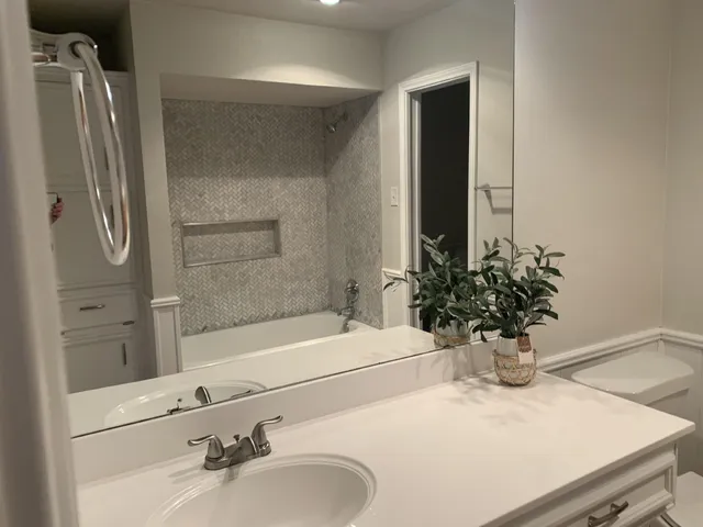 a bathroom with a sink and a mirror