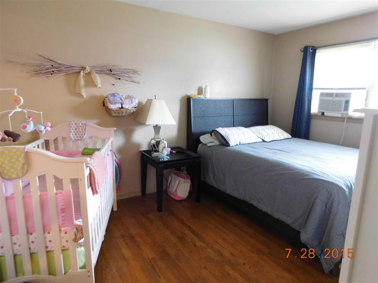 1807 South Alpine Road Rockford, IL 61108 - Photo 6 of 9 a bedroom with a bed and a window
