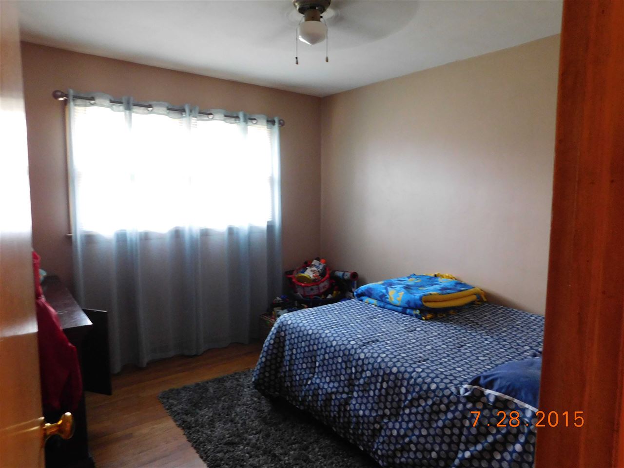 1807 South Alpine Road Rockford, IL 61108 - Photo 7 of 9 a bedroom with a bed and a window