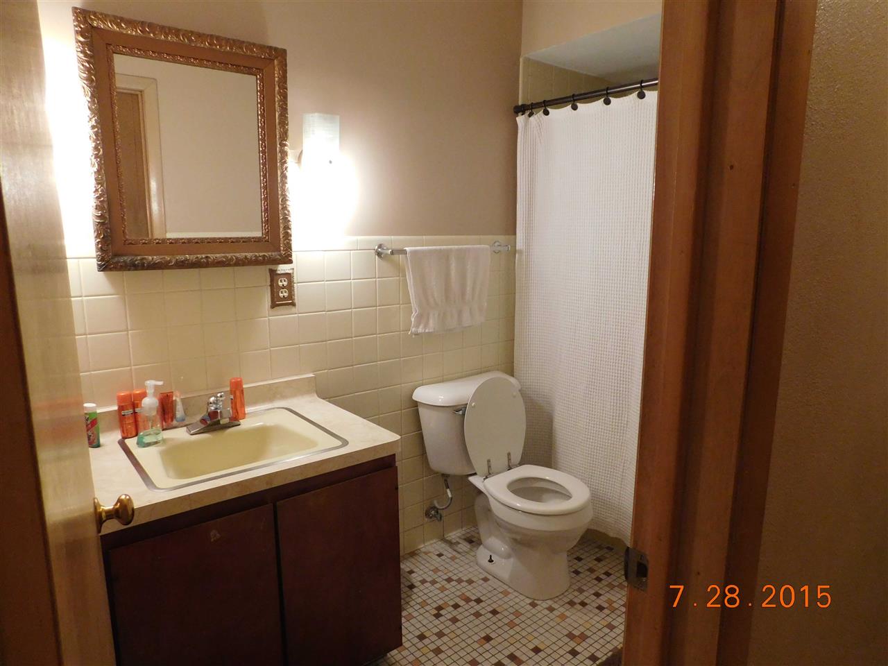 1807 South Alpine Road Rockford, IL 61108 - Photo 9 of 9 a bathroom with a sink a toilet and a mirror