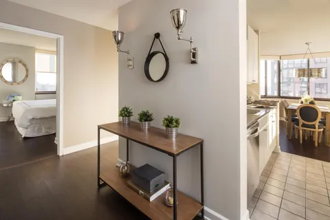 a kitchen with a stove a sink and a refrigerator