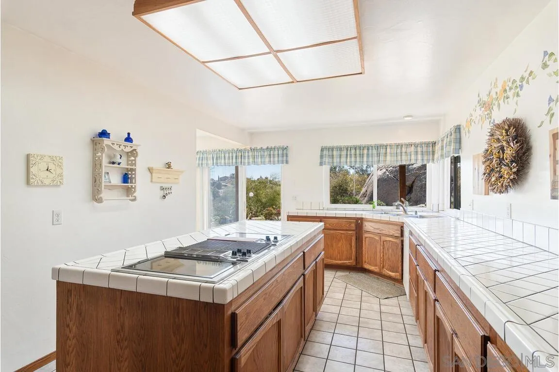 2877 Polk Road Alpine, CA 91901 - Photo 13 of 40 a kitchen that has a sink and a stove