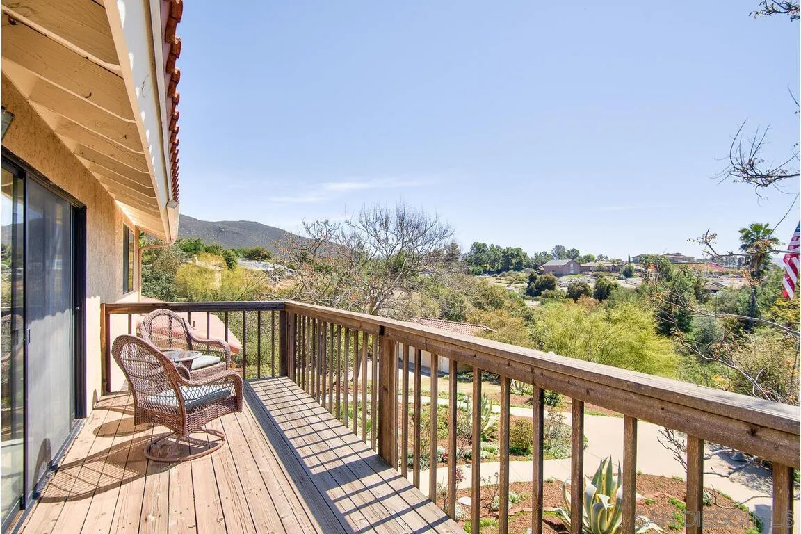 2877 Polk Road Alpine, CA 91901 - Photo 17 of 40 a view of a balcony with wooden floor and fence