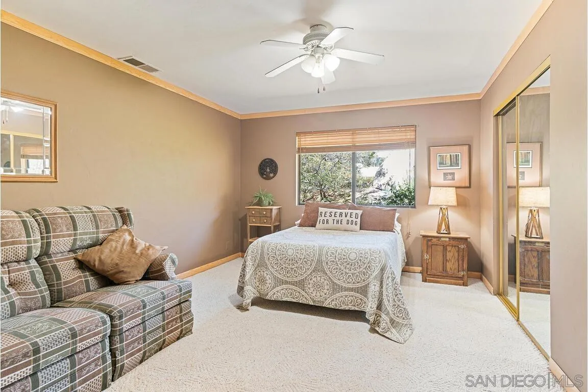 2877 Polk Road Alpine, CA 91901 - Photo 20 of 40 a living room with a bed furniture and a large window